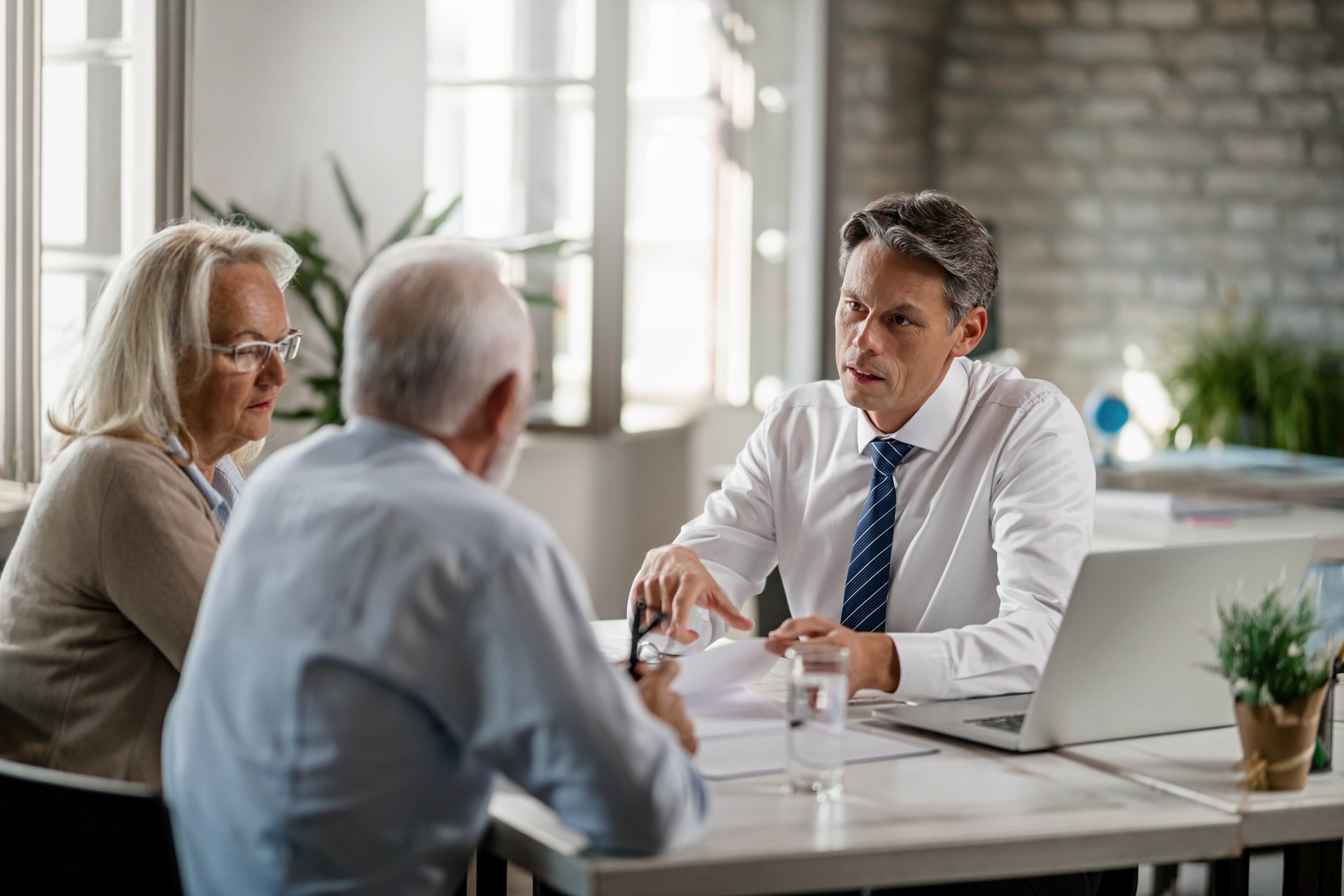 Salesman presenting product to customers